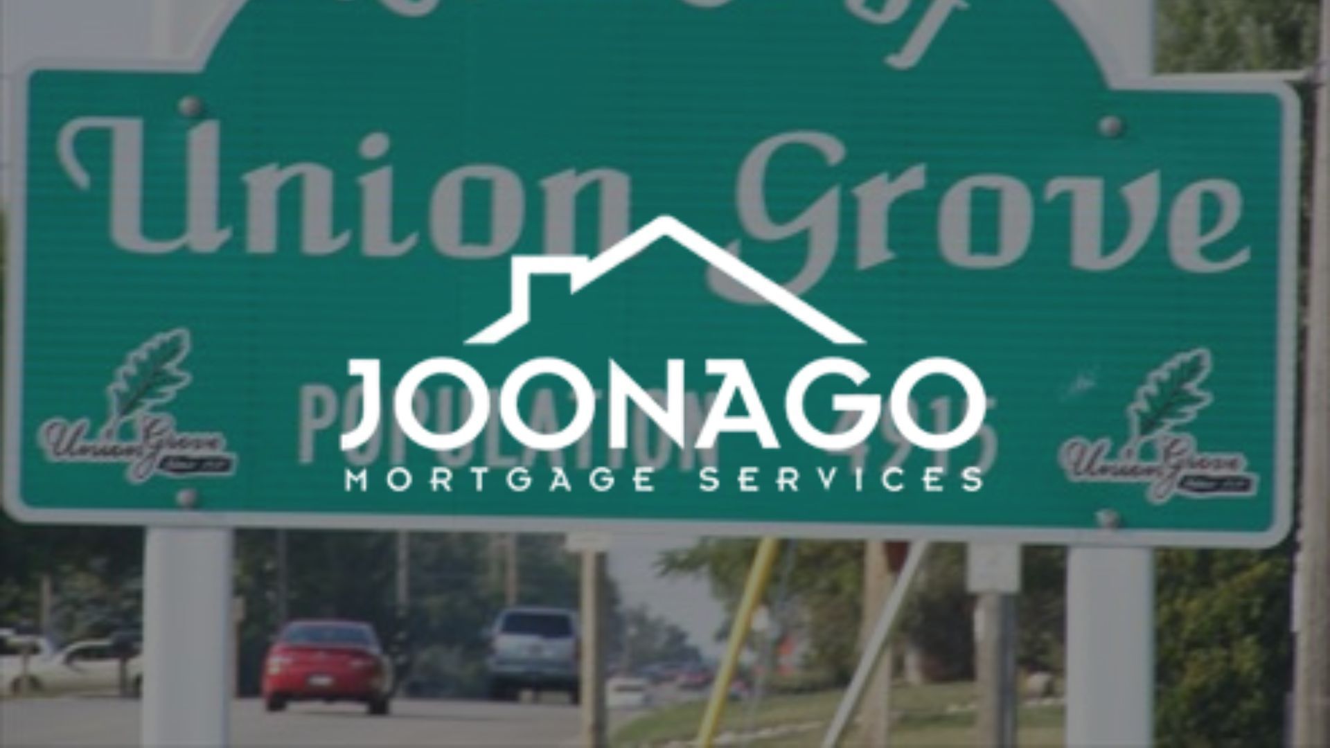 Sign for Union Grove, Wisconsin, with a JONNAGO Mortgage Services logo overlaid.