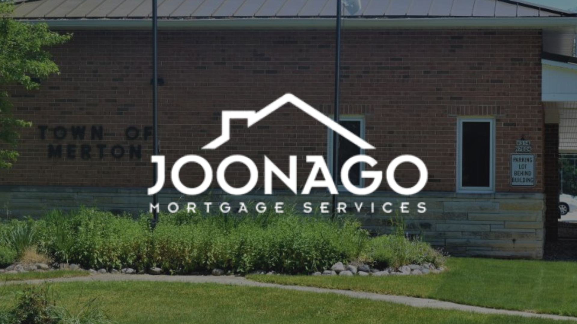 Joonago Mortgage Services logo over a brick building with the Town of Merton signage.