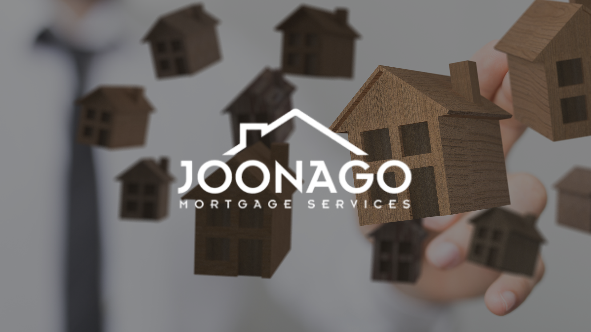 A person is holding a bunch of small houses in their hand with joonago mortgage logo on top