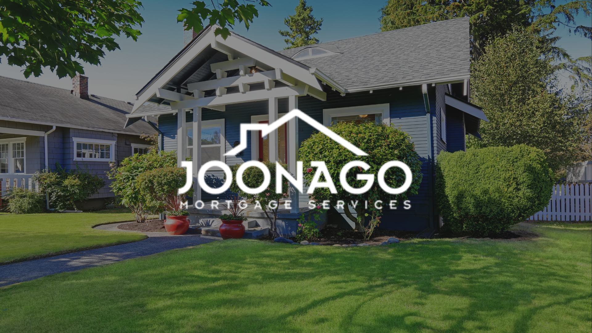 A blue house with a logo for joonago mortgage services in front of it.