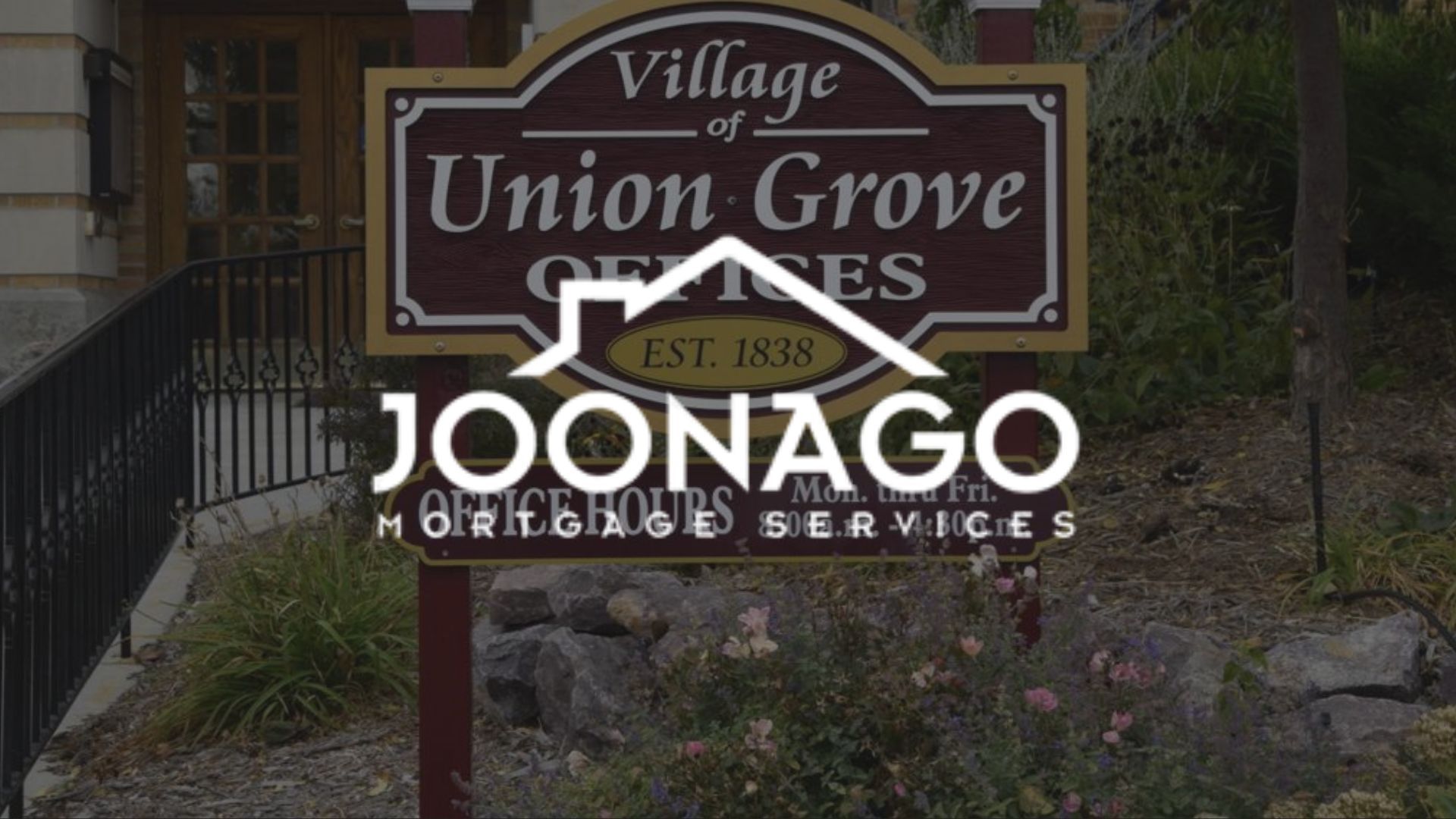 Sign for Village of Union Grove Offices, with Joonago Mortgage Services logo in front.