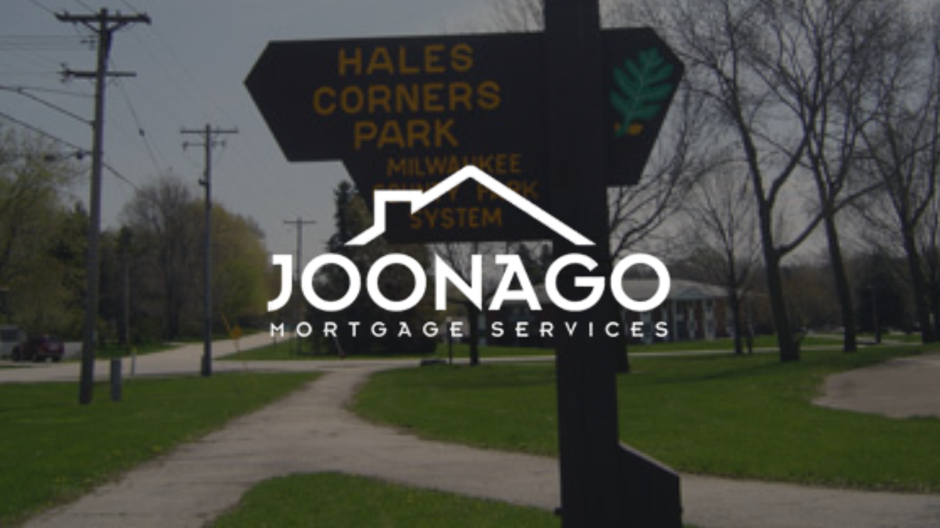 Sign for Hales Corners Park, Milwaukee, WI, with Joonago Mortgage Services logo overlaid.