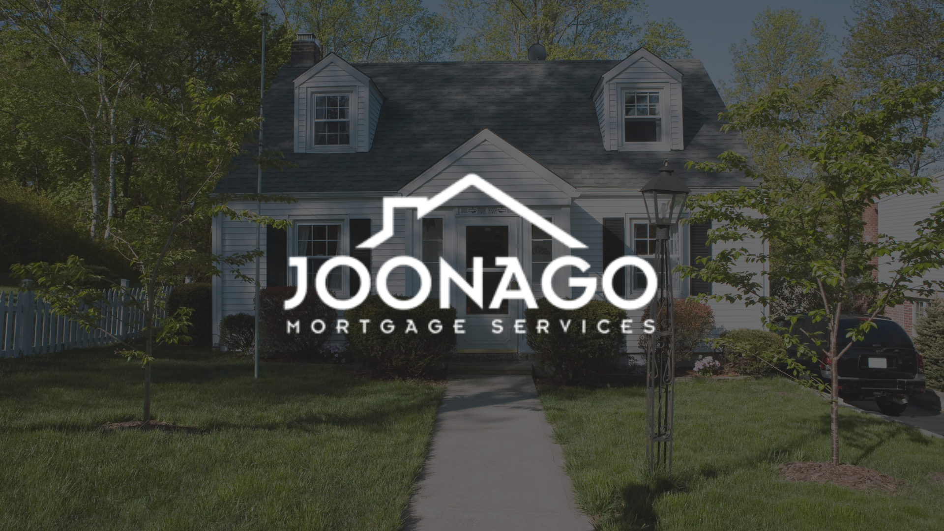 The logo for joonago mortgage services is on the front of a house.
