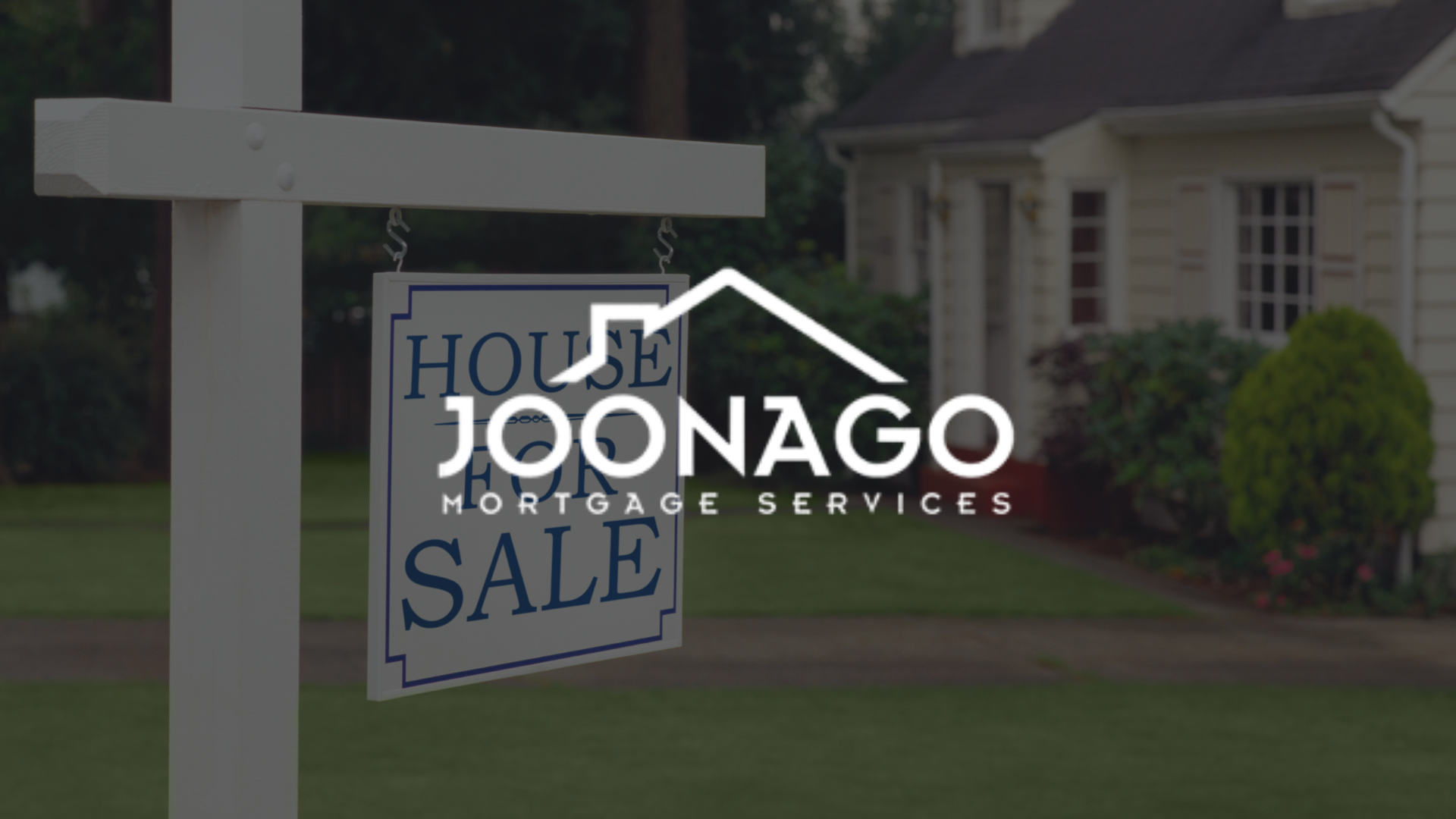 A house for sale sign is in front of a house.