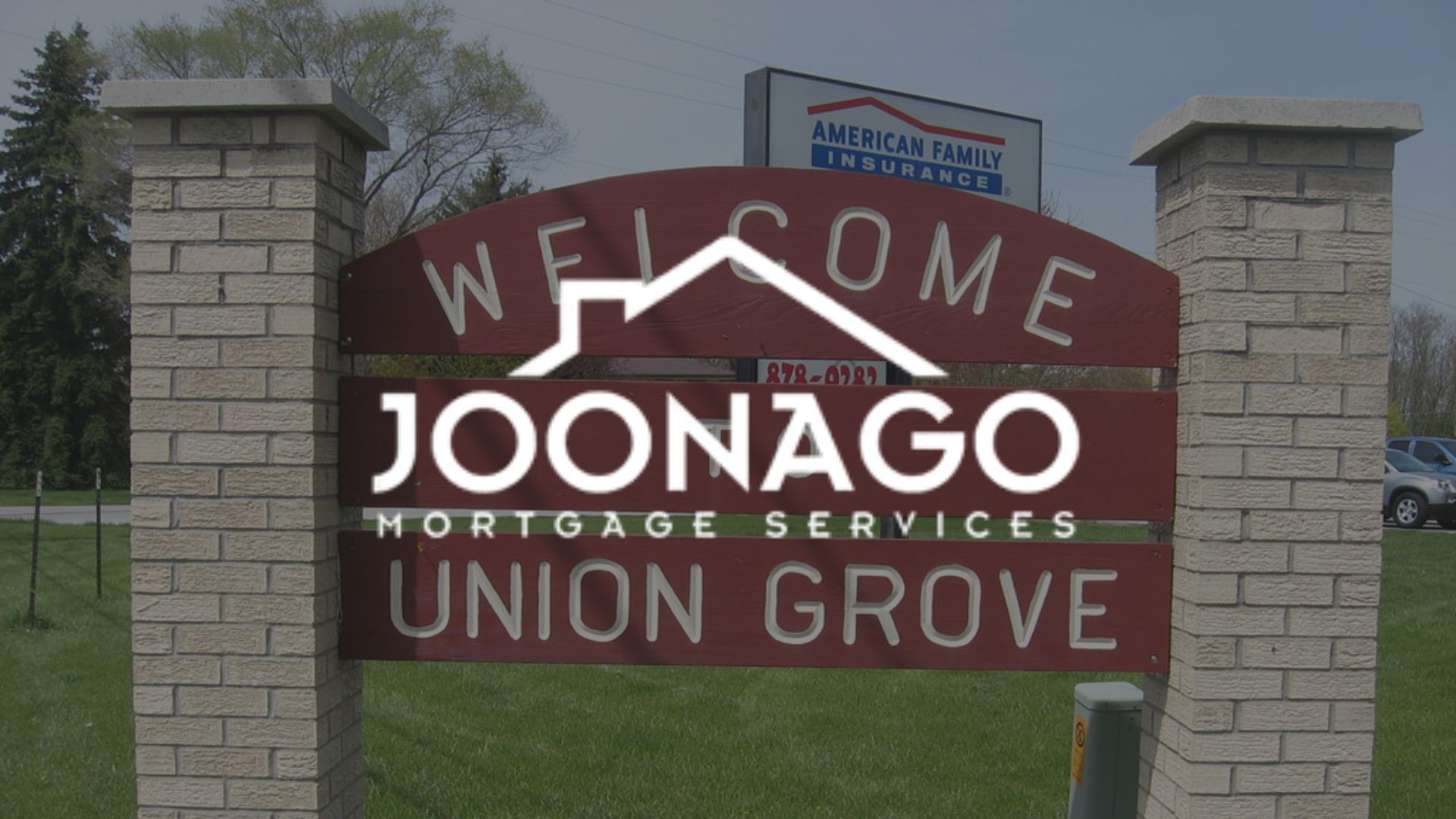 Welcome sign for Union Grove, Wisconsin, with Joonago Mortgage Services logo.