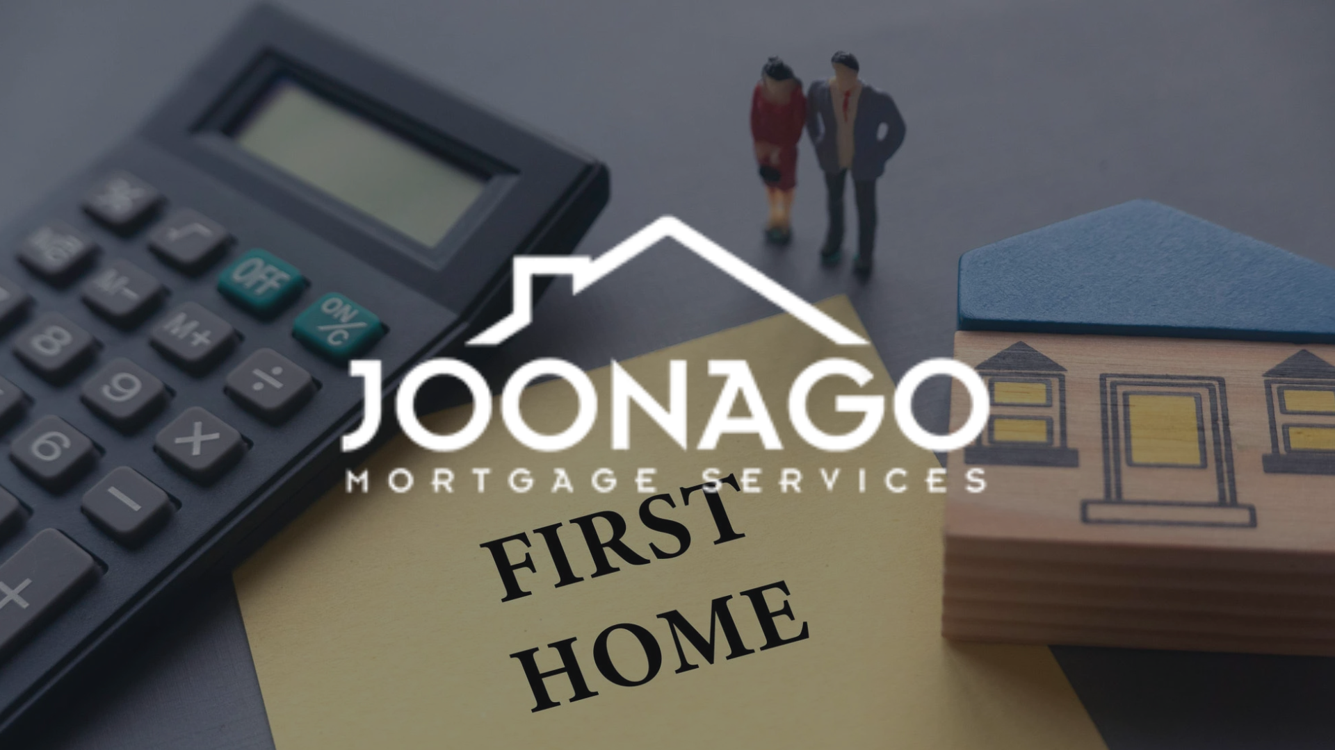 Calculator, miniature house and couple figurines, and a note reading