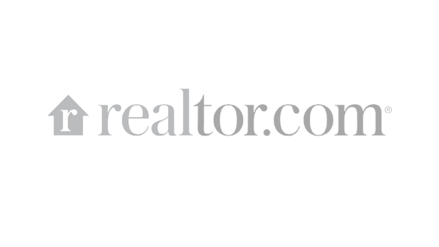 The logo for realtor.com is a gray logo on a white background.