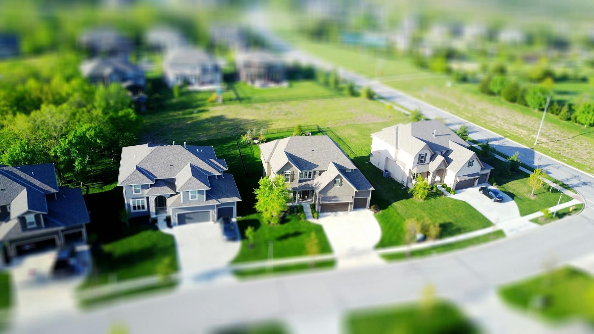 An aerial view of a residential neighborhood with houses and trees.