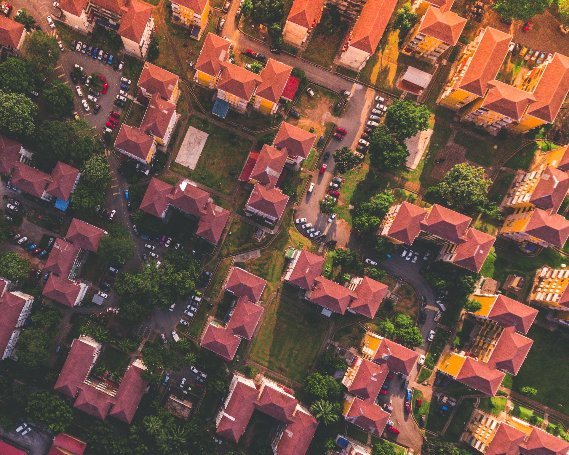An aerial view of a residential area with lots of houses and trees