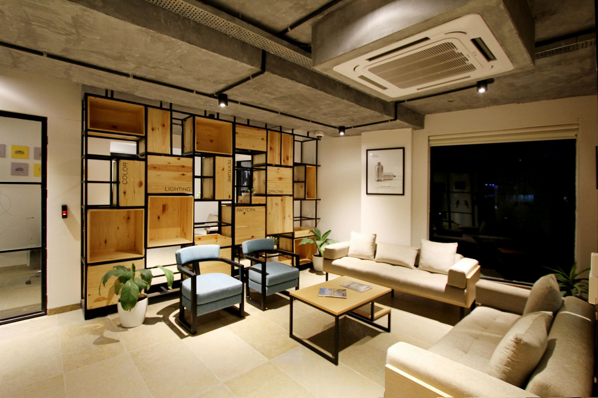 A living room with a couch , chairs and a coffee table