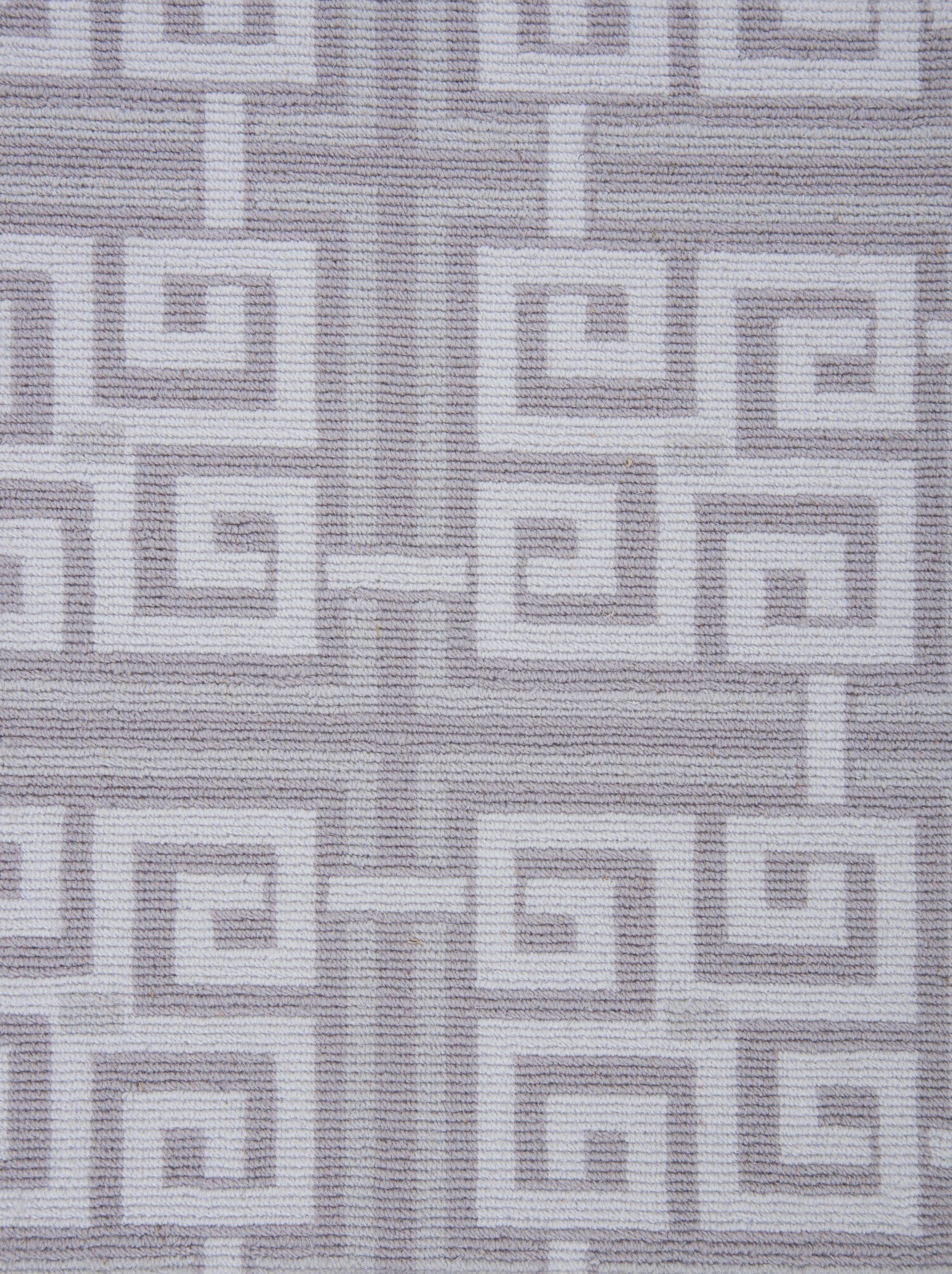 Gray fabric with white geometric pattern.