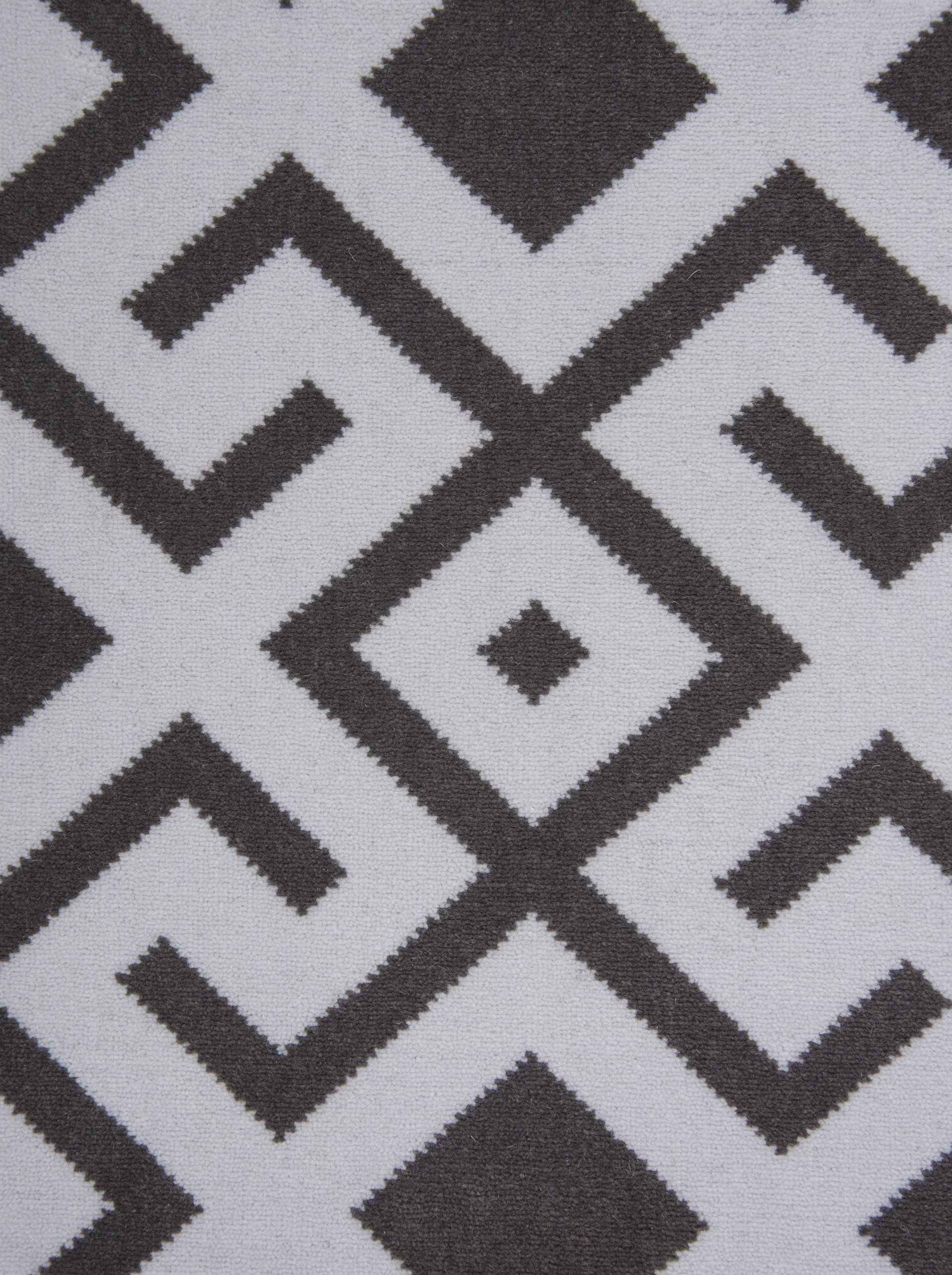 Gray and white geometric patterned fabric.
