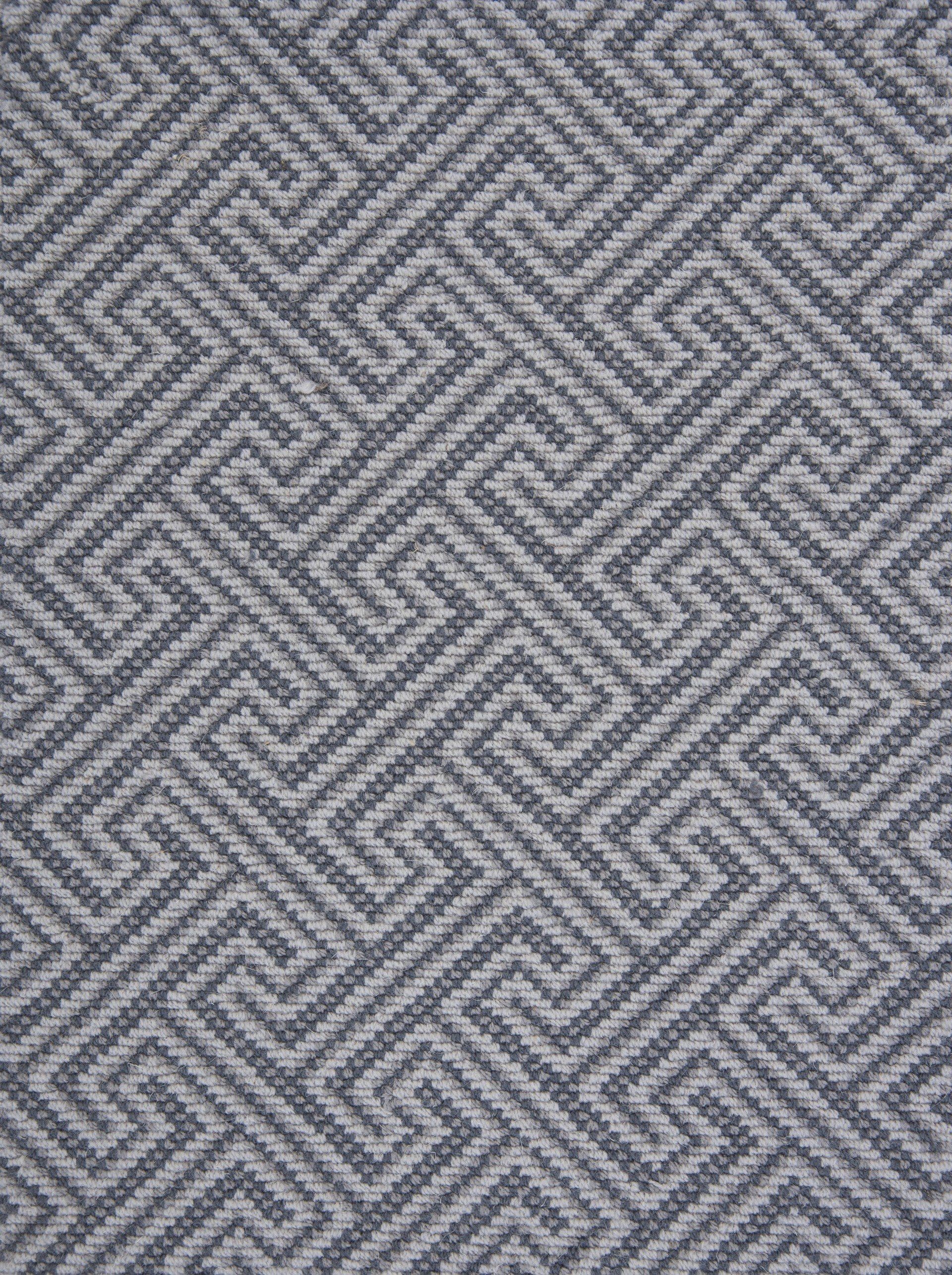 Gray and white geometric patterned fabric.
