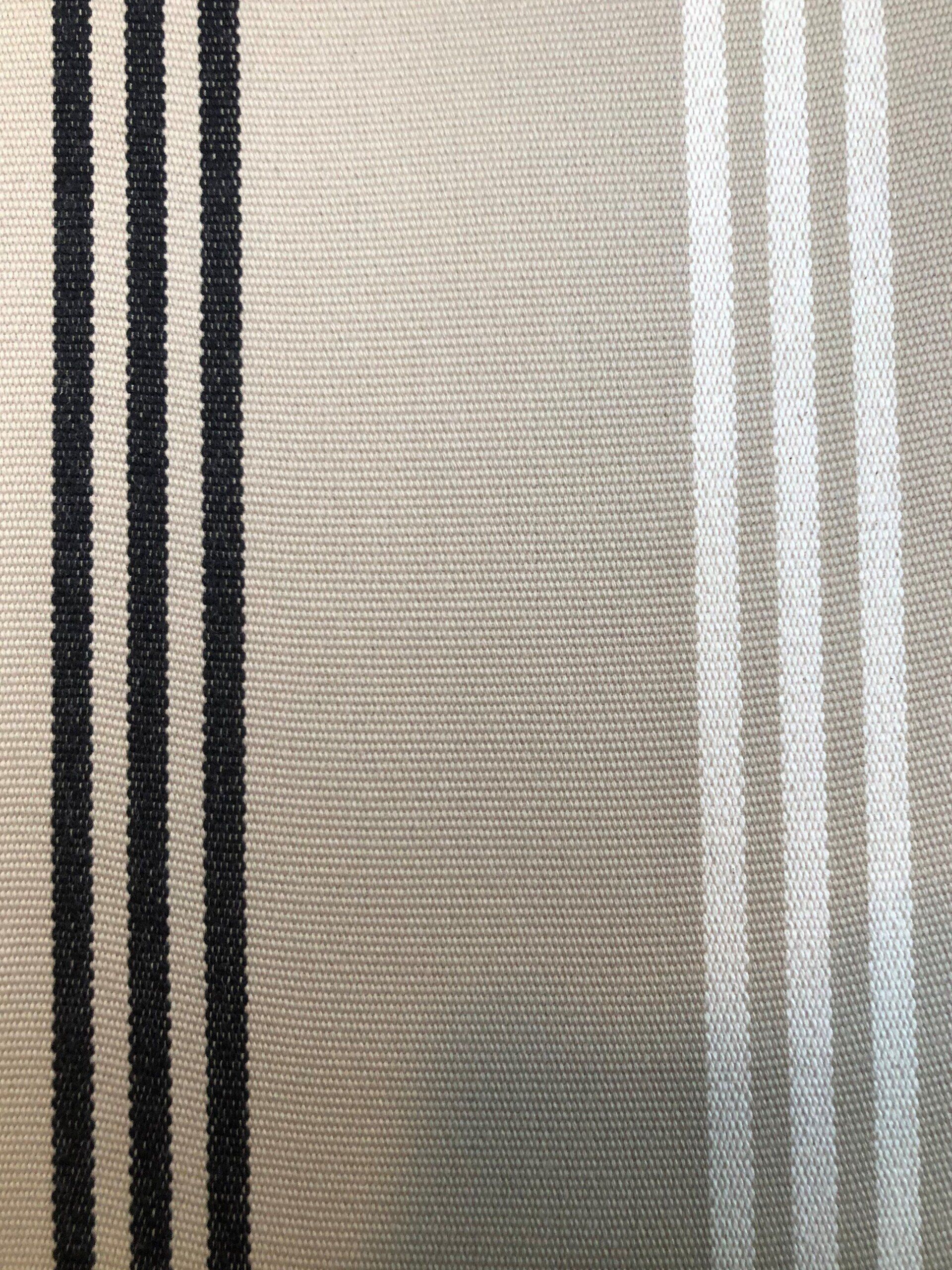 Beige fabric with black and white vertical stripes.