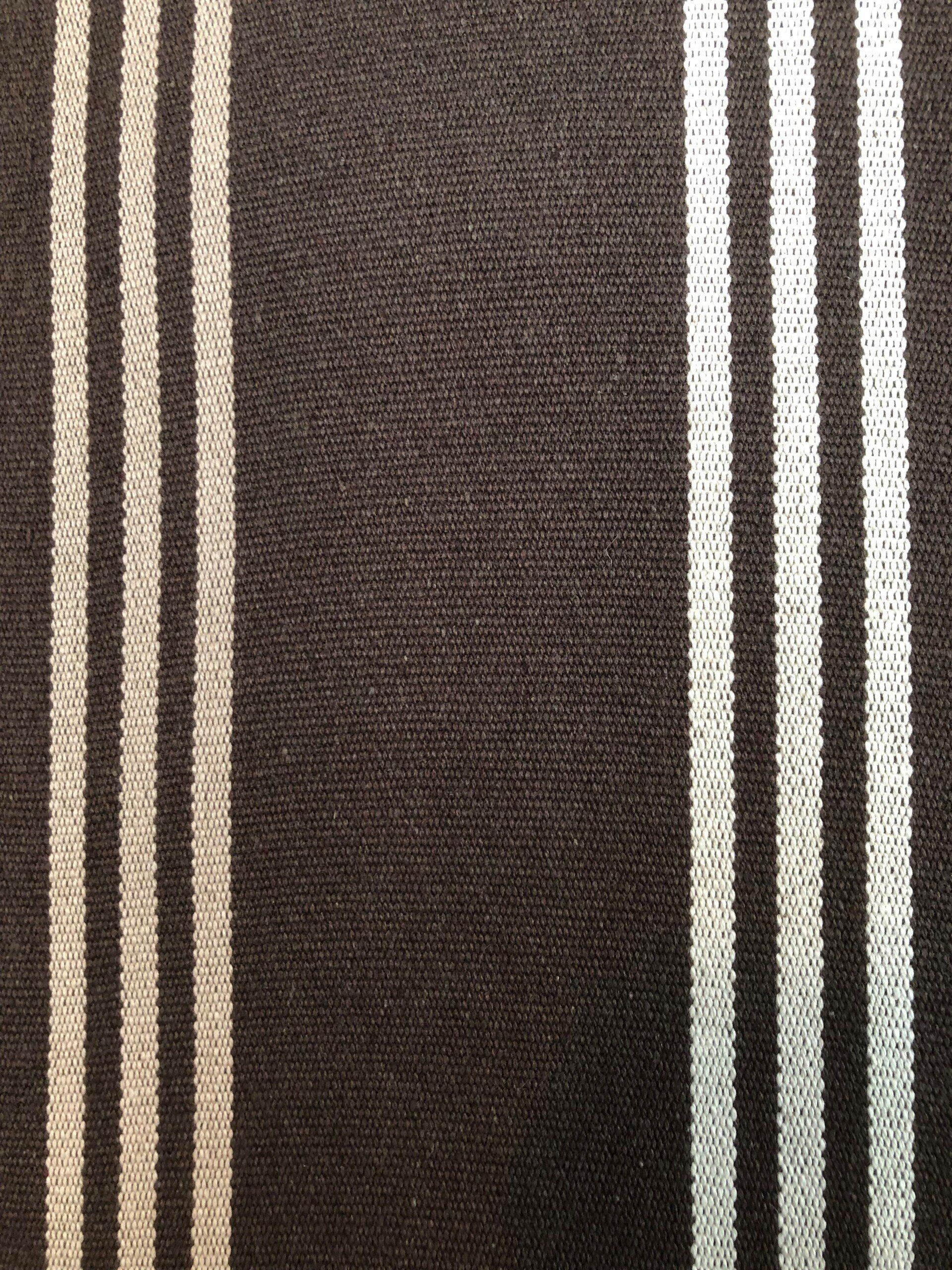 Brown fabric with vertical stripes of white.