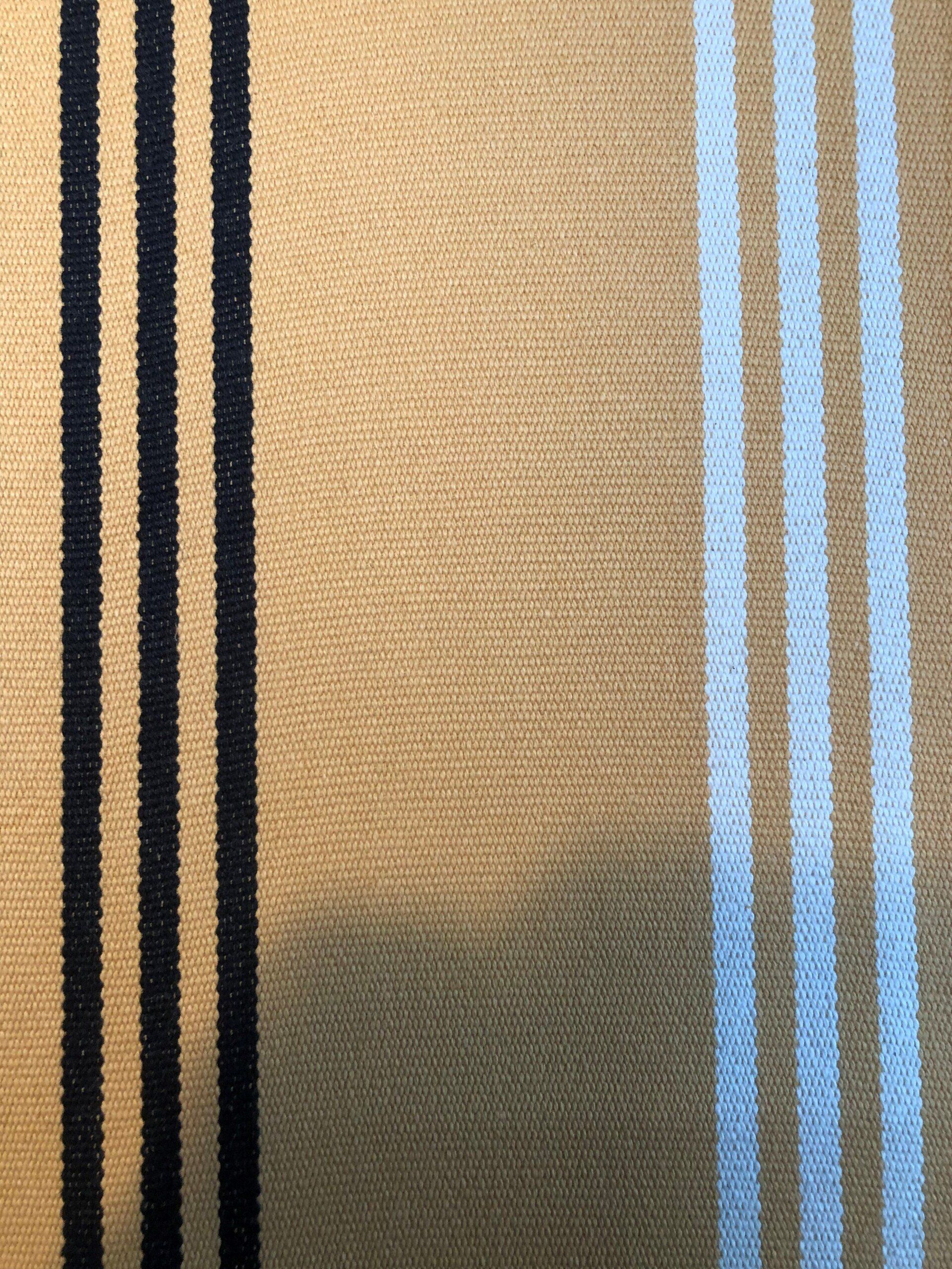 Tan fabric with black and white vertical stripes.
