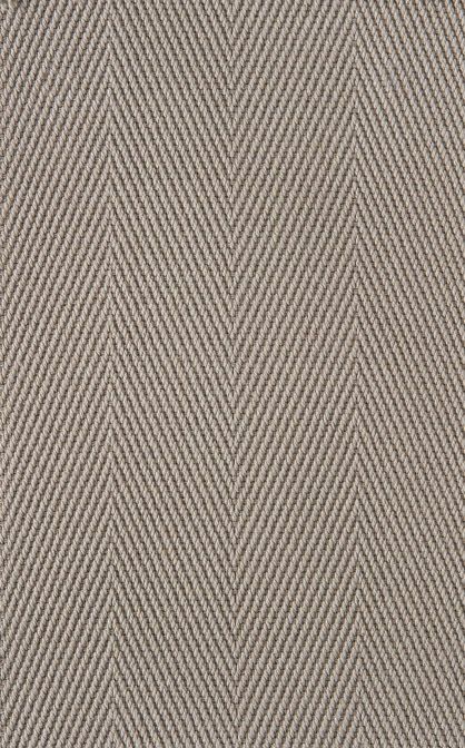 Close-up of beige herringbone-patterned fabric.