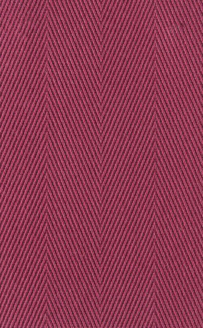 Close-up of a textured fabric in a dark red-purple color with a herringbone pattern.