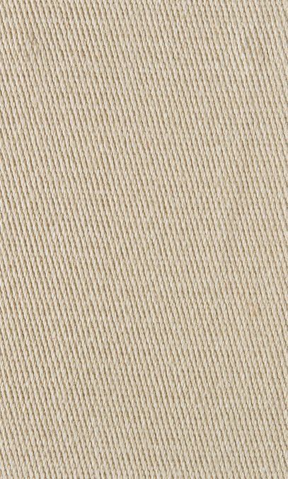 Close-up of beige fabric with a diagonal ribbed weave.