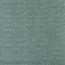 Close-up view of textured, blue-green denim fabric with diagonal ribbing.