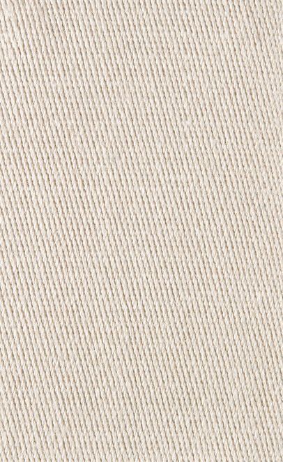 Close-up of beige fabric with diagonal weave.