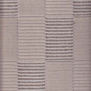 Close-up of beige fabric with a repeating ribbed rectangular pattern.