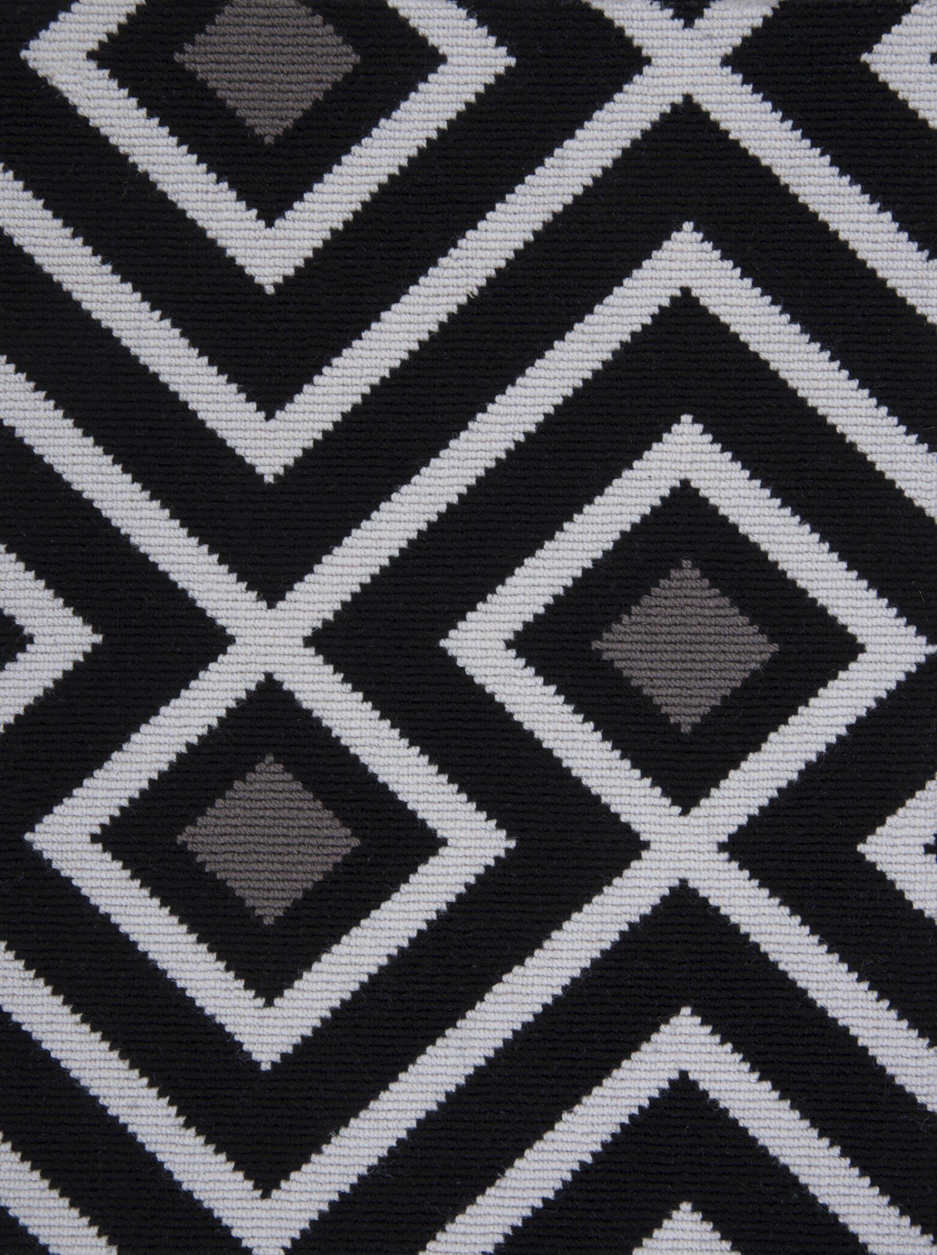 Black and white geometric diamond pattern fabric with gray diamond accents.