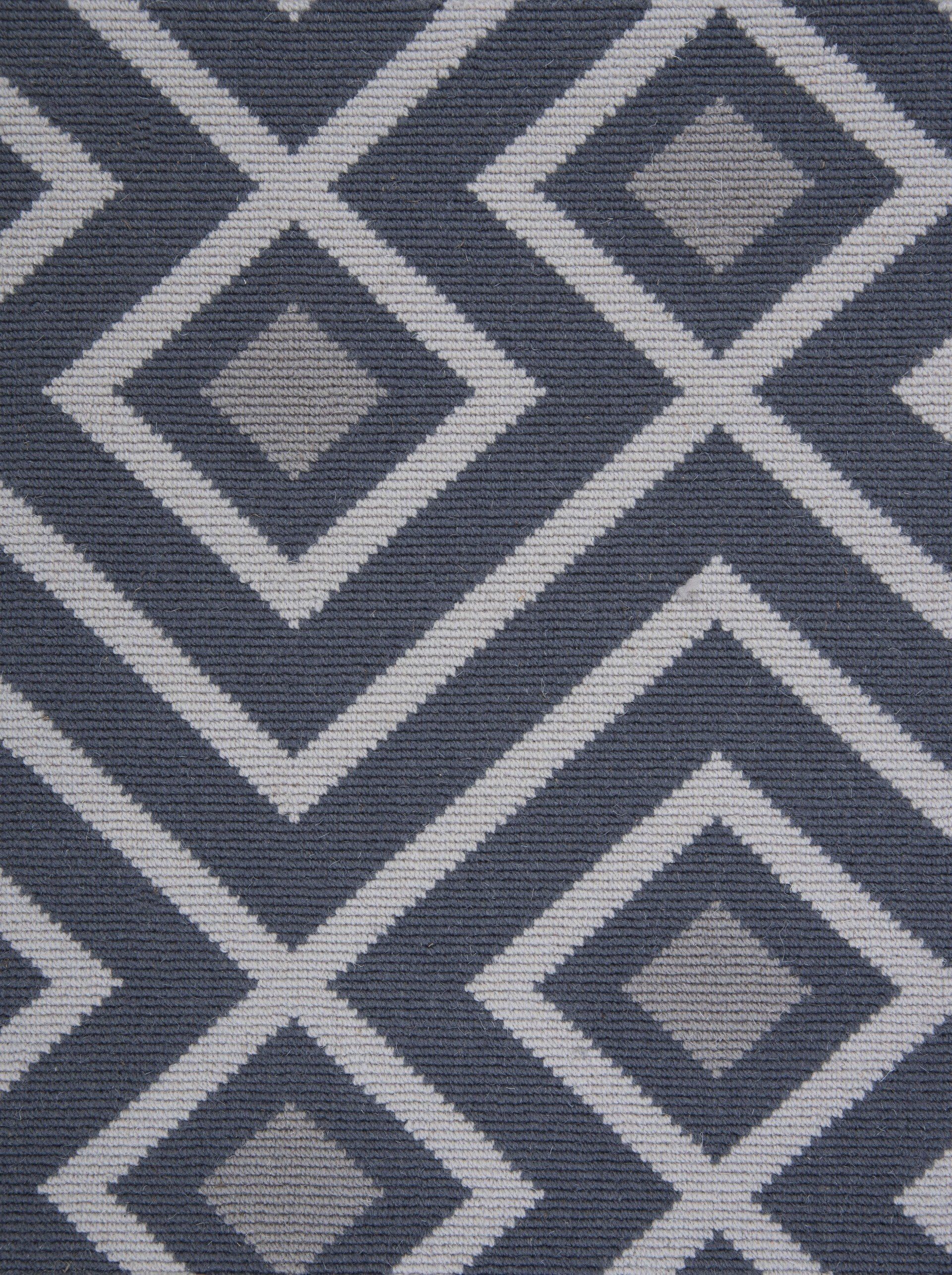 Geometric navy and gray diamond pattern.