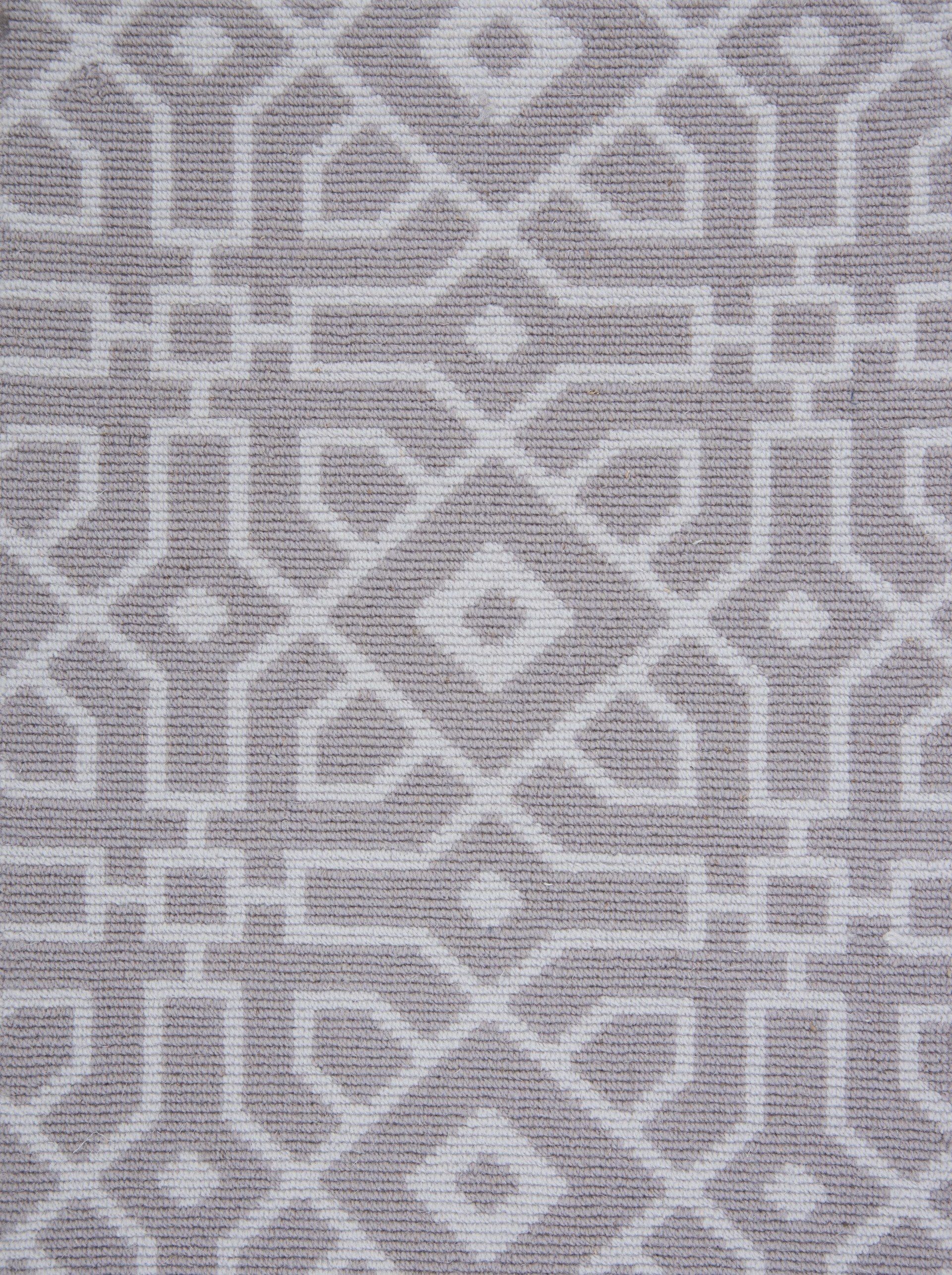 Gray and white geometric patterned fabric.