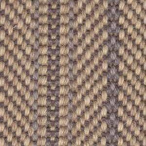 Close-up of woven fabric with alternating light and dark brown diagonal and vertical stripes.