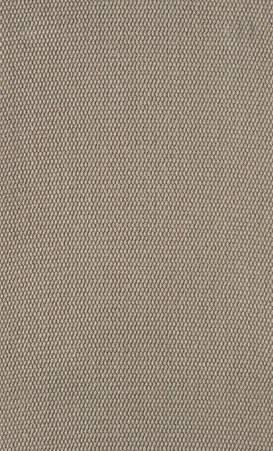 Close-up of a textured, light brown fabric with a woven pattern.