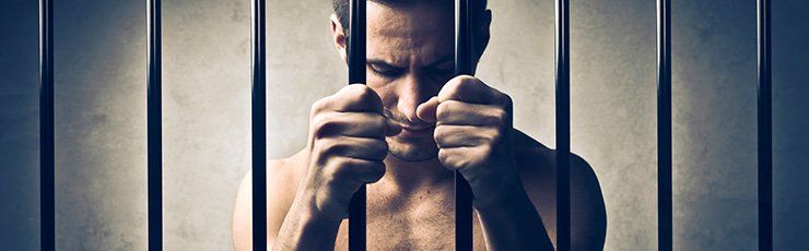 A prisoner behind bars