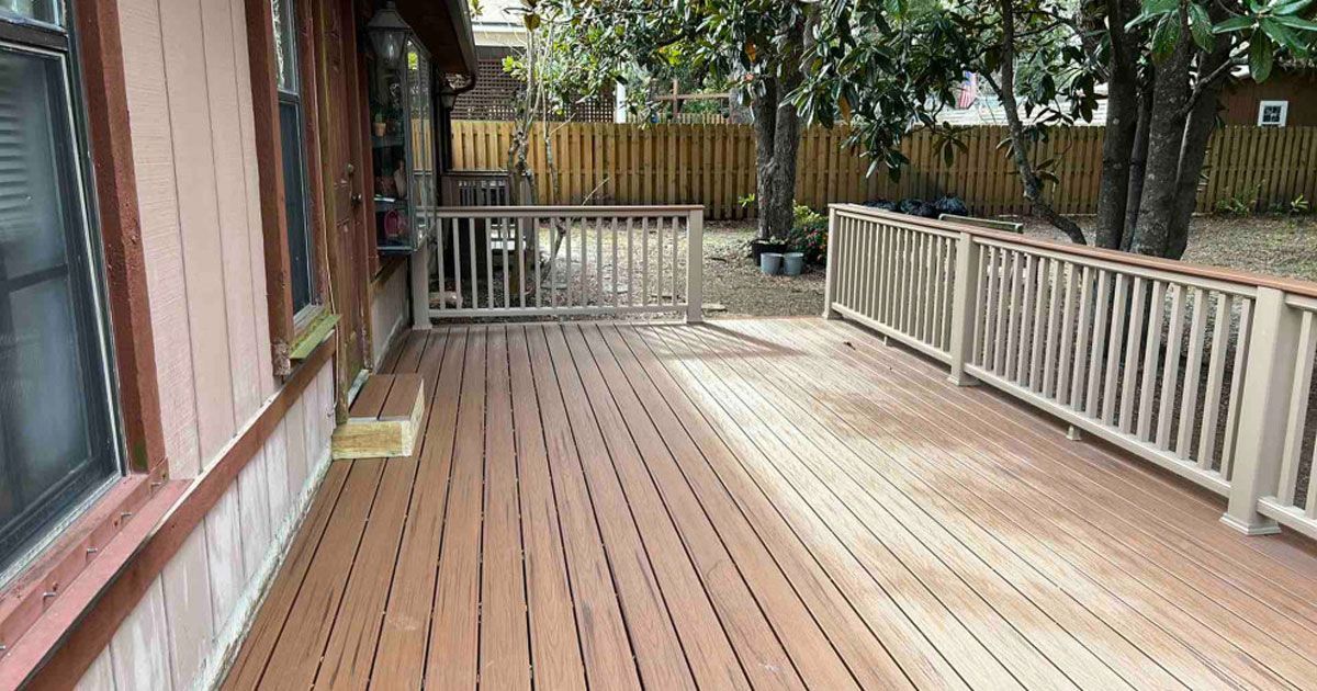 A kitchen with wooden cabinets and a white counter top