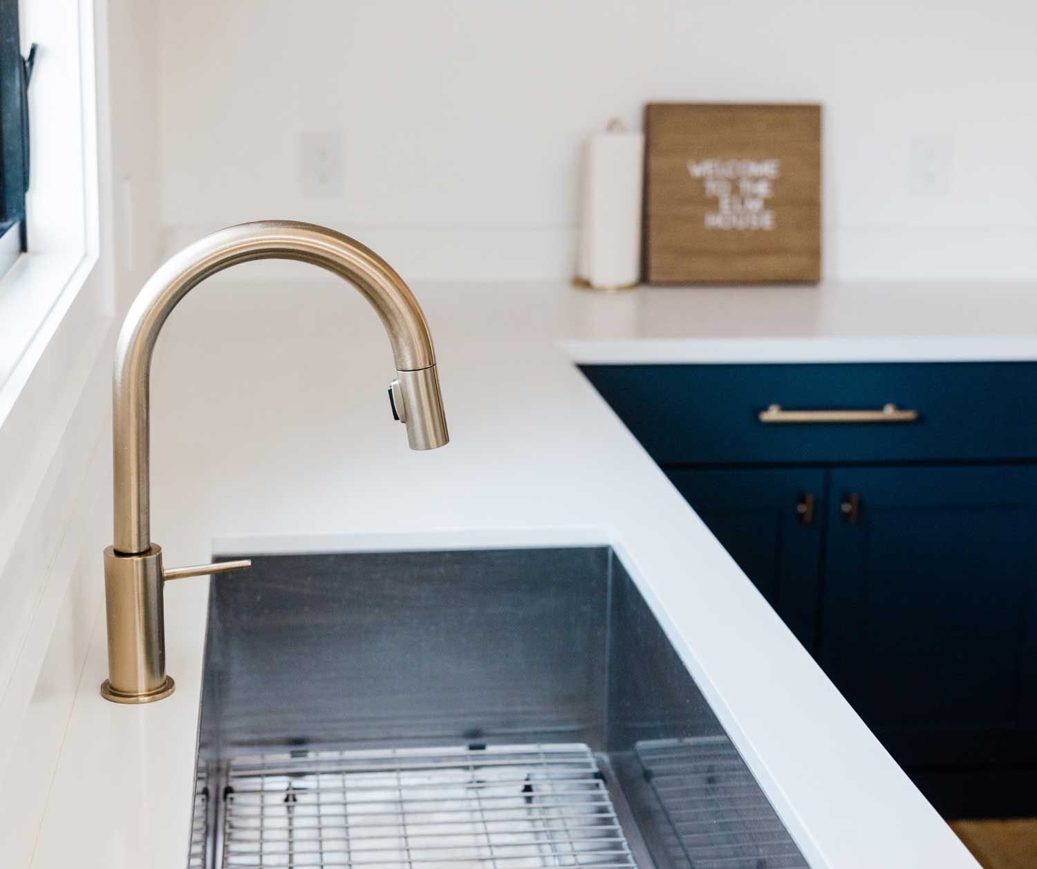 A kitchen sink with a faucet.