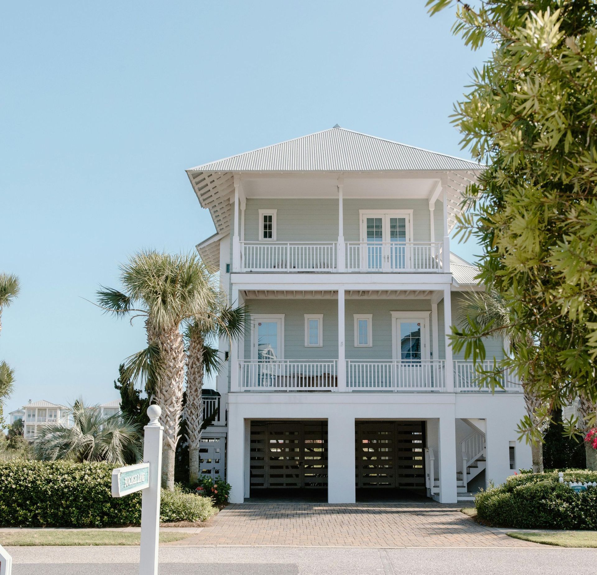 A house with a sign in front of it that says first