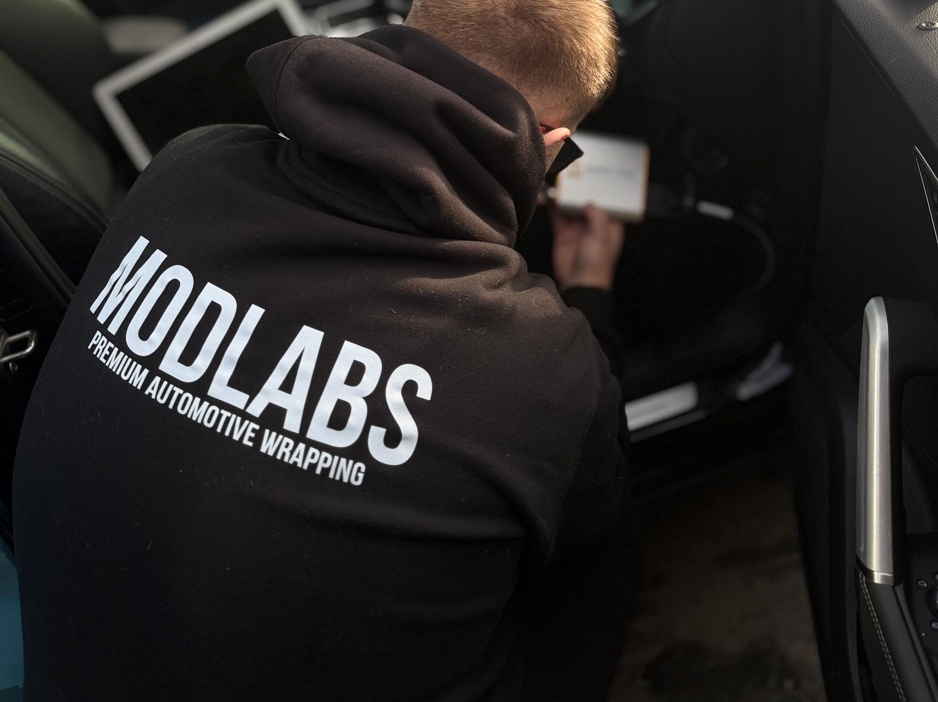 Person in black hoodie with 