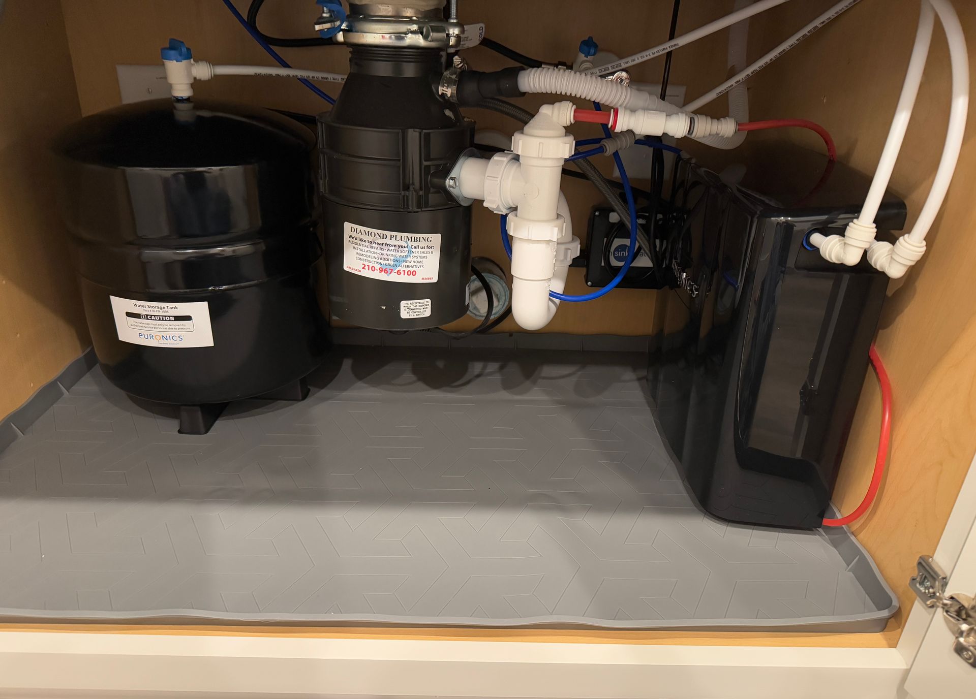 A sink with a garbage disposal underneath it