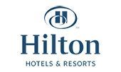 The logo for hilton hotels and resorts is blue and white.