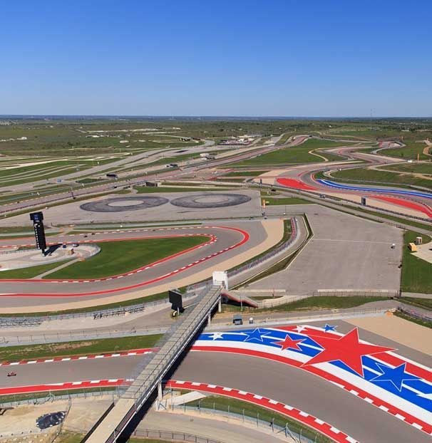 An aerial view of a race track with red white and blue stars
