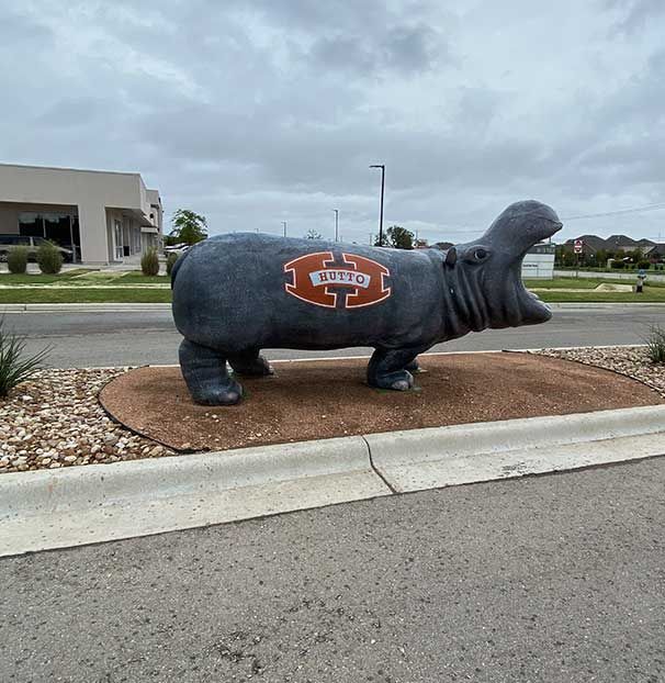 A statue of a hippo with the word buffalo on it