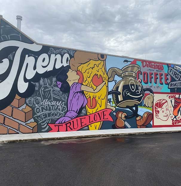 A mural on the side of a building that says true love