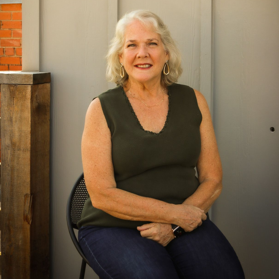 White silhouette of a person on a gray background.