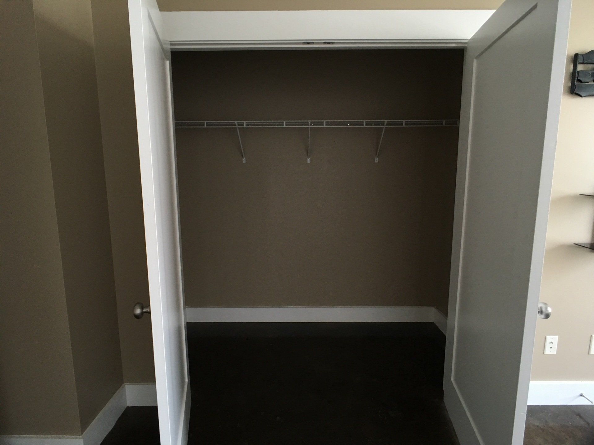 A large closet with shelf for additional storage