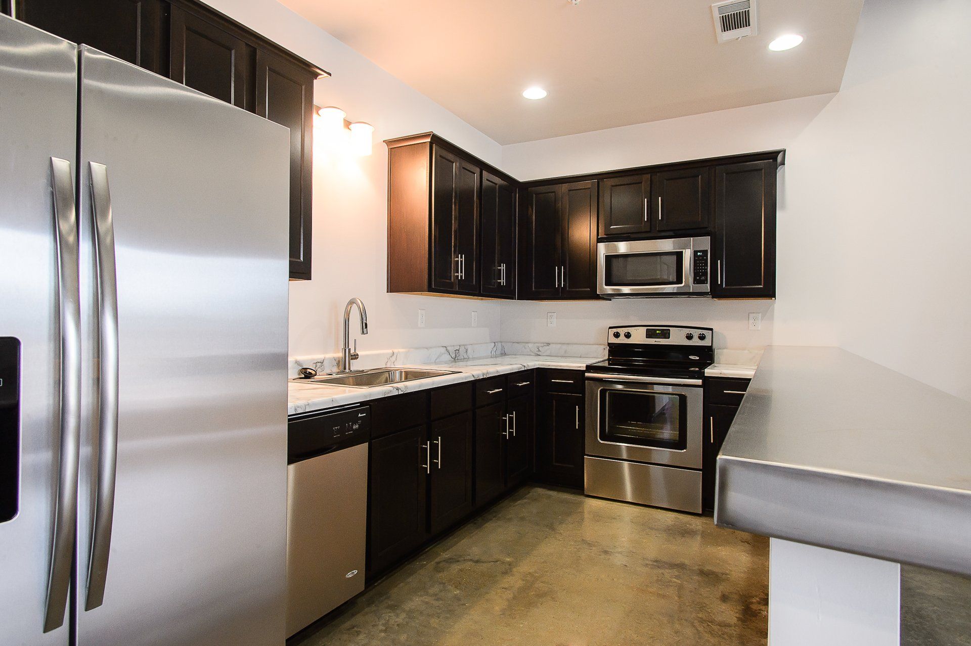 A newly renovated kitchen with stainless steel appliances