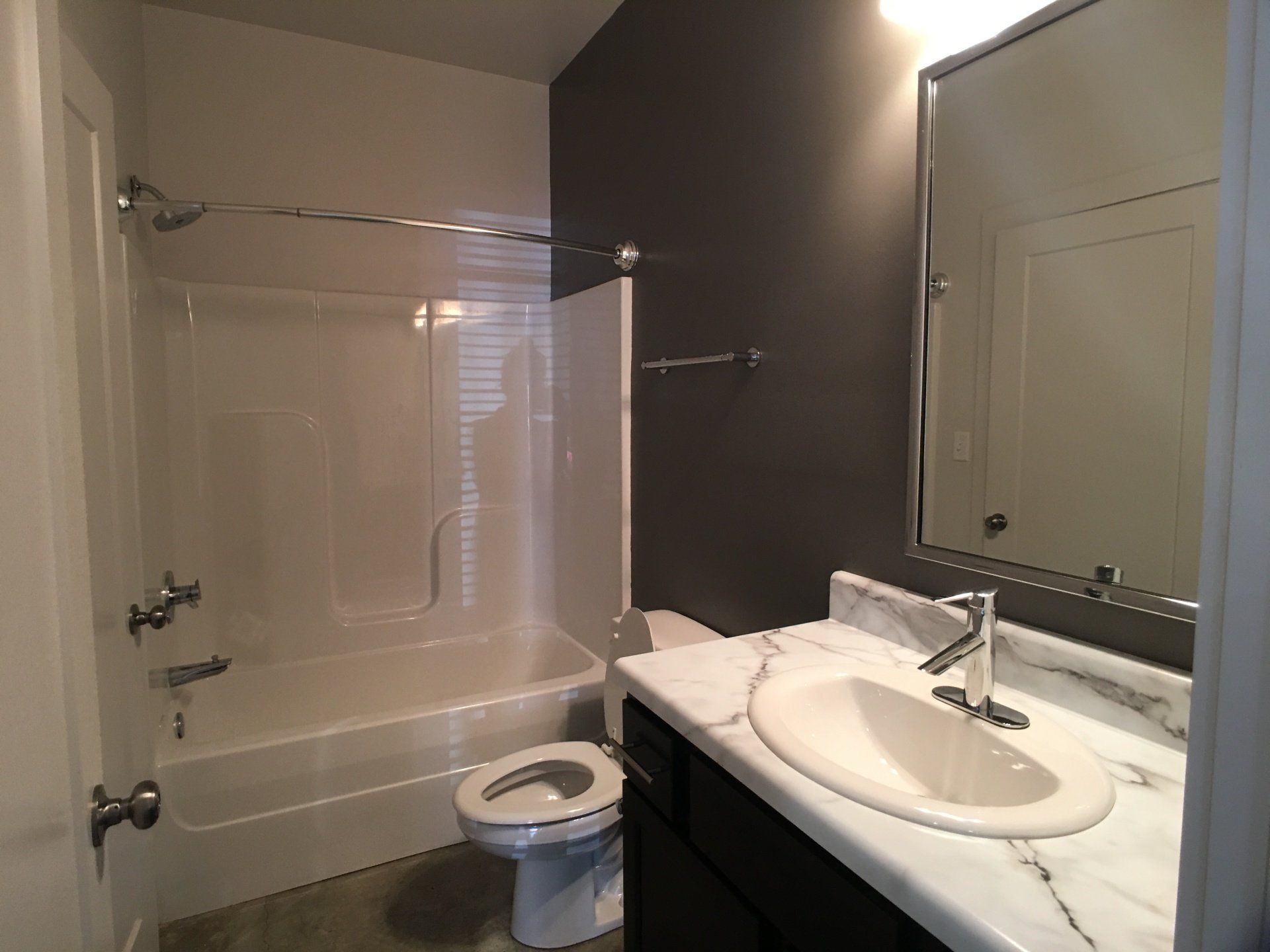 A modern bathroom with shower and tub