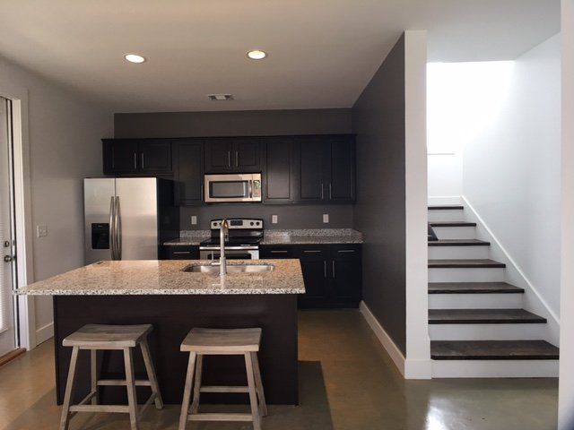 The kitchen next to the stairway