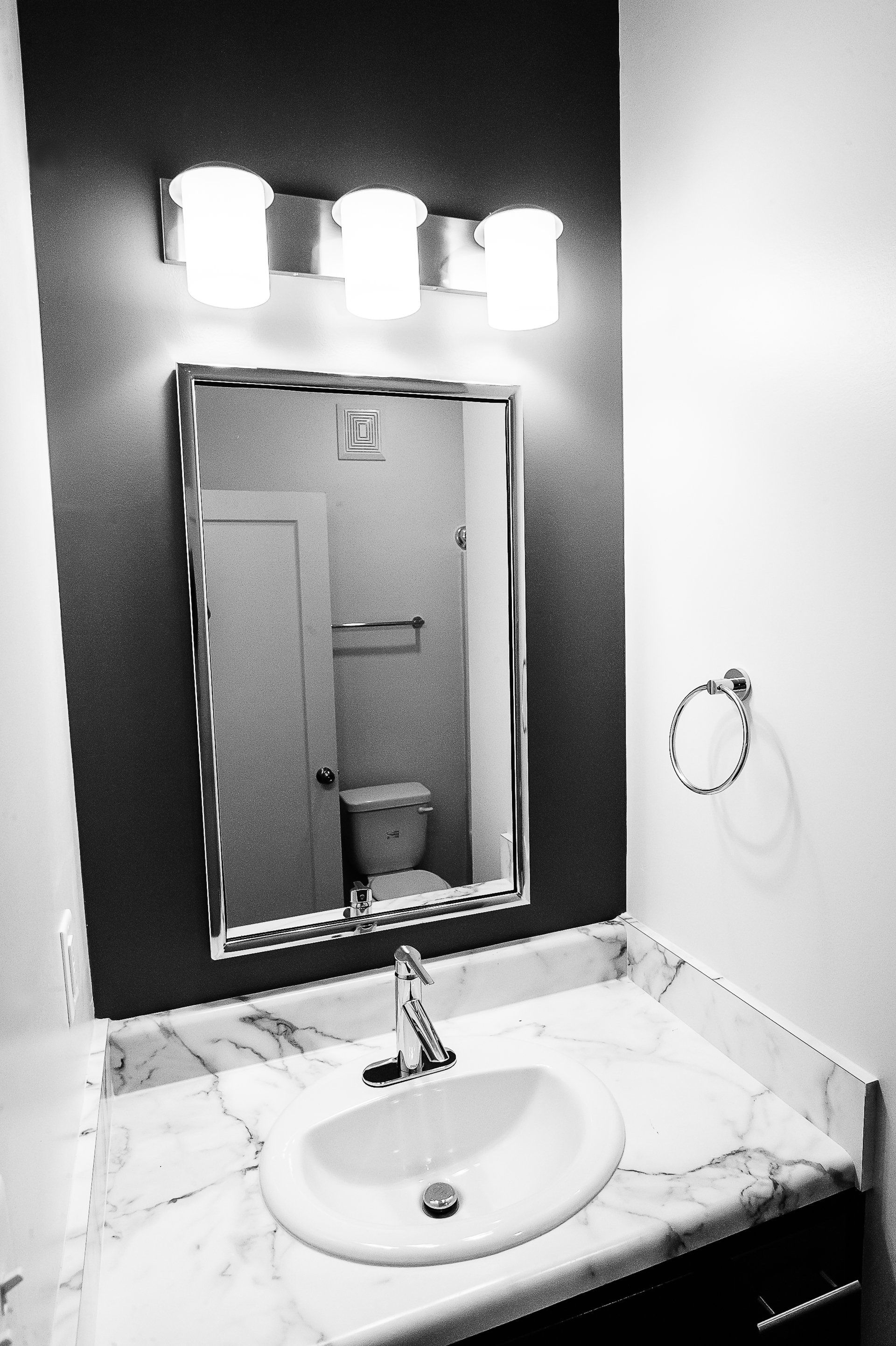 A bathroom sink and mirror