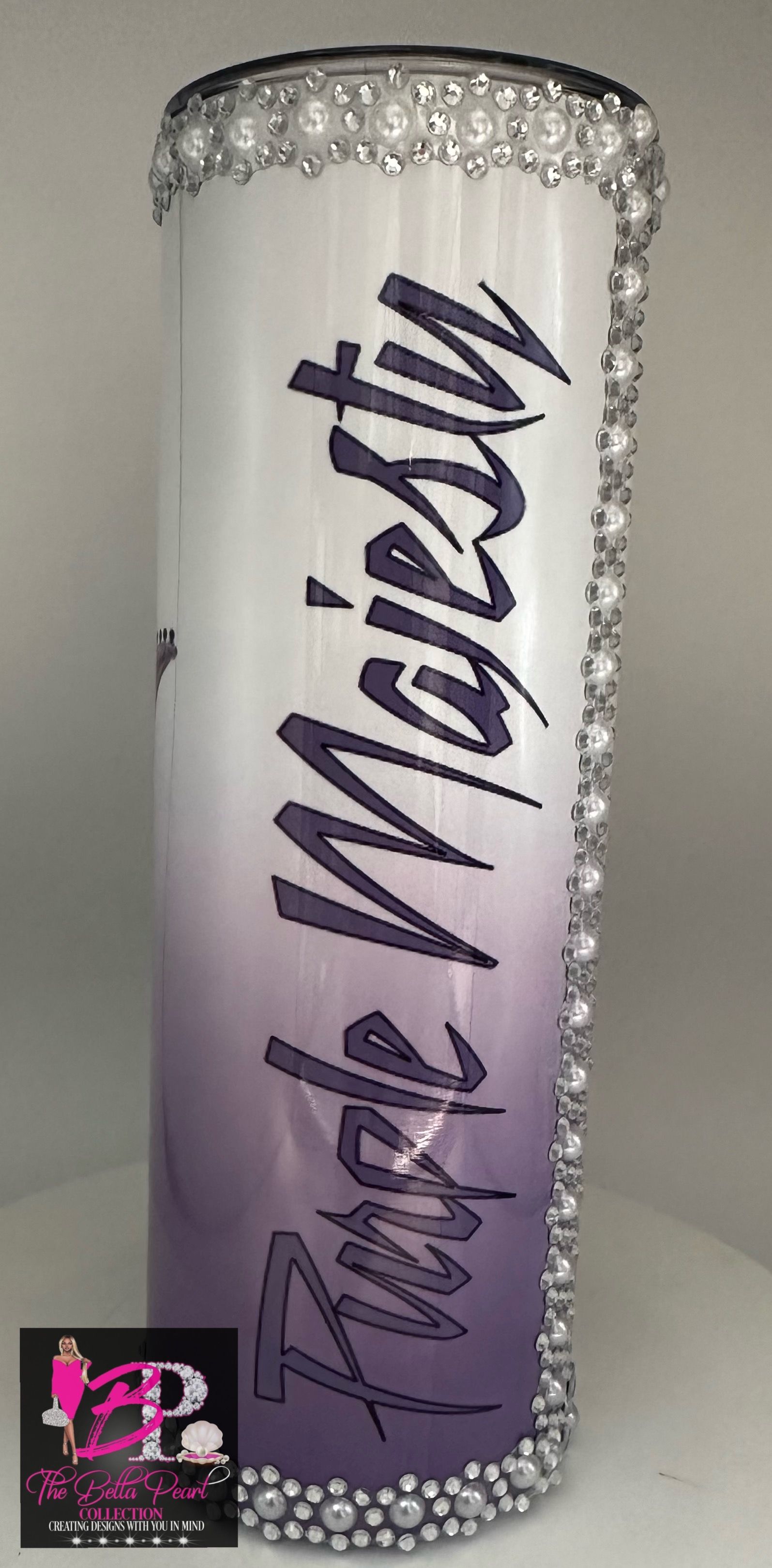 A tumbler with a cartoon of prince playing a guitar.