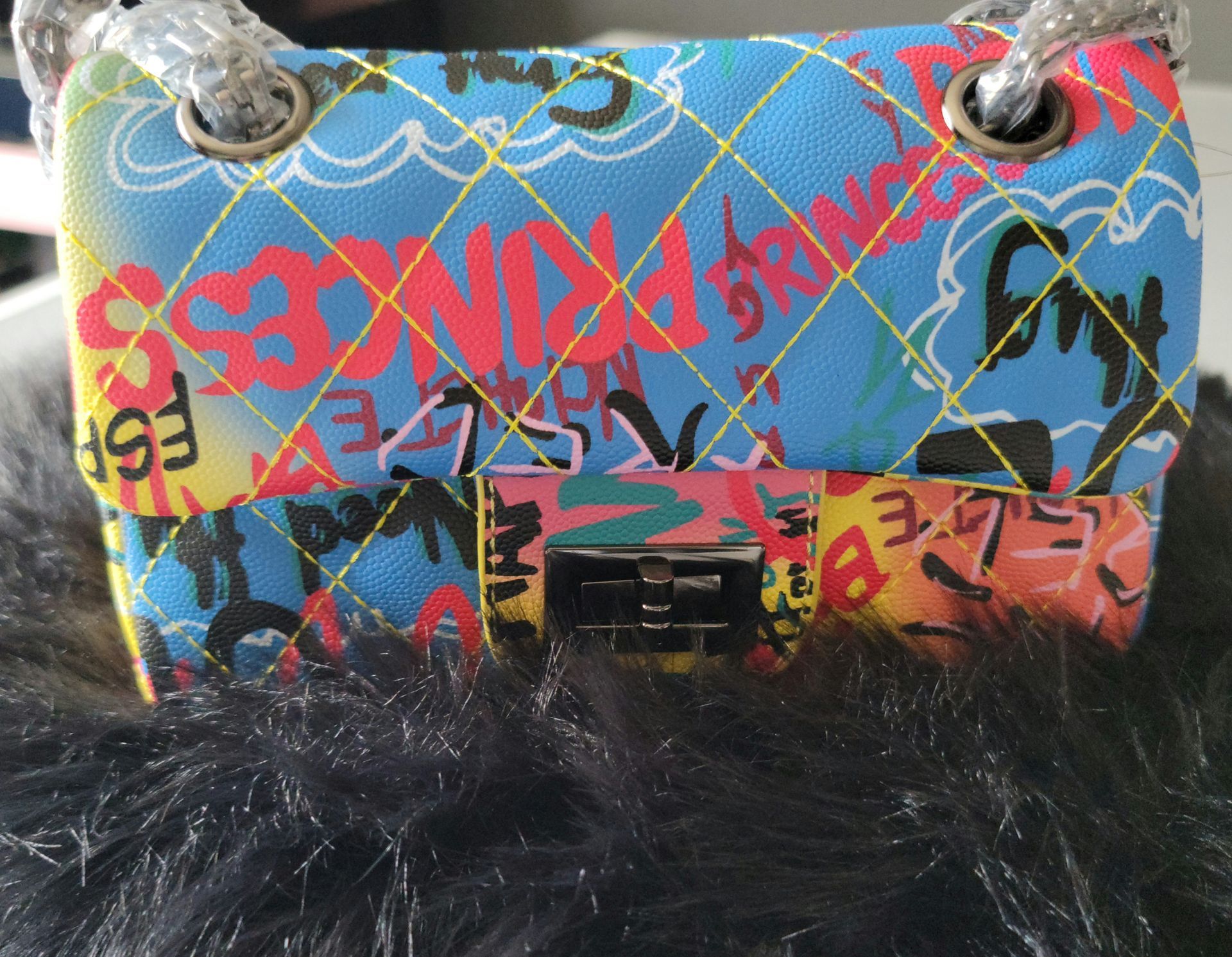 A colorful purse with the word princess on it