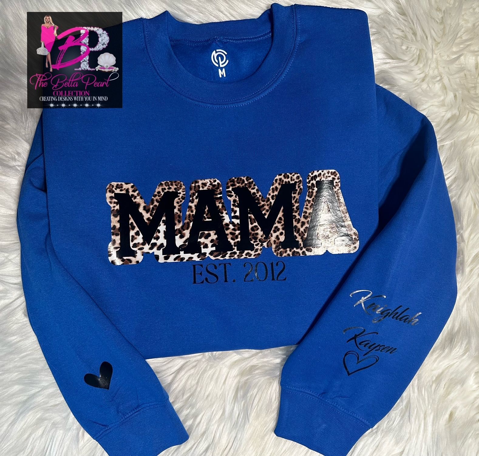 A blue sweater with the word mama on it